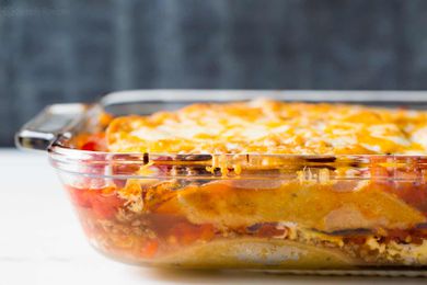 Mexican Lasagna made with tortillas, beef, beans, and cheese ready to serve