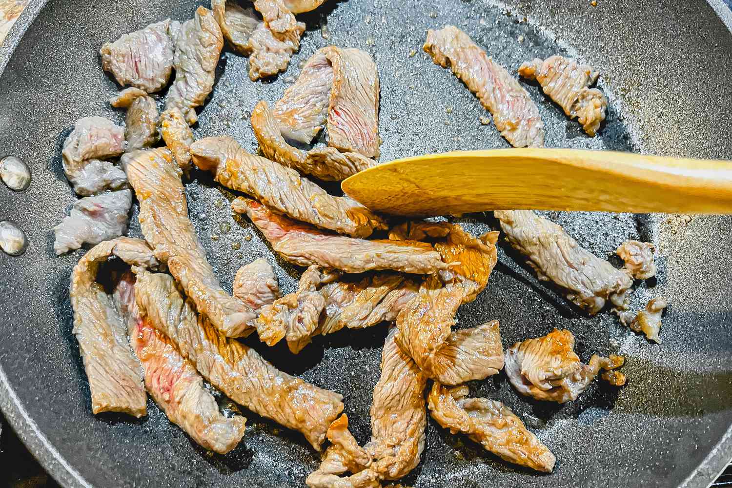 Slices of Beef Cooked in a Pan for Seaweed Rice Roll