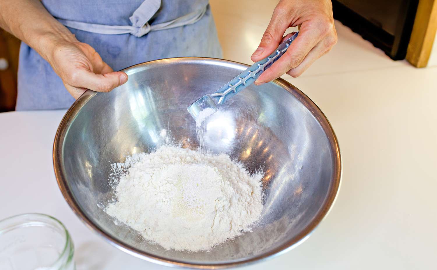 Teaspoon of Salt Added to a Bowl with Other Dry Ingredients for How to Make Pie Dough by Hand
