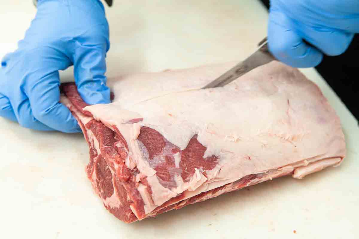 cut through fatty end of rack of lamb