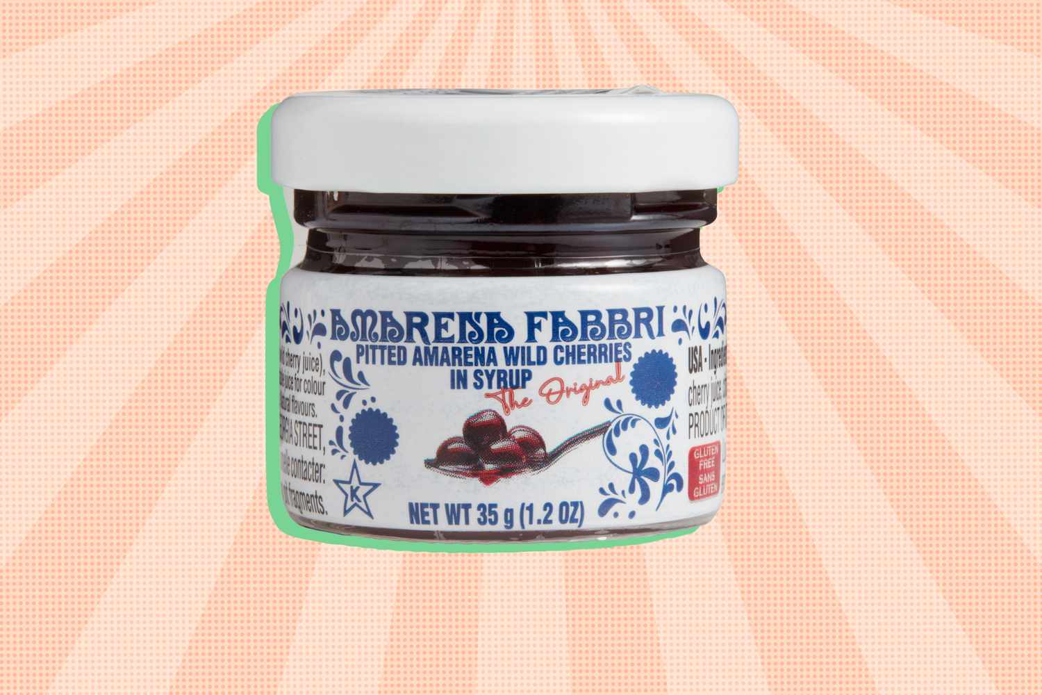 Small jar labeled Amarena Fabbri pitted amarena wild cherries in syrup on a patterned background