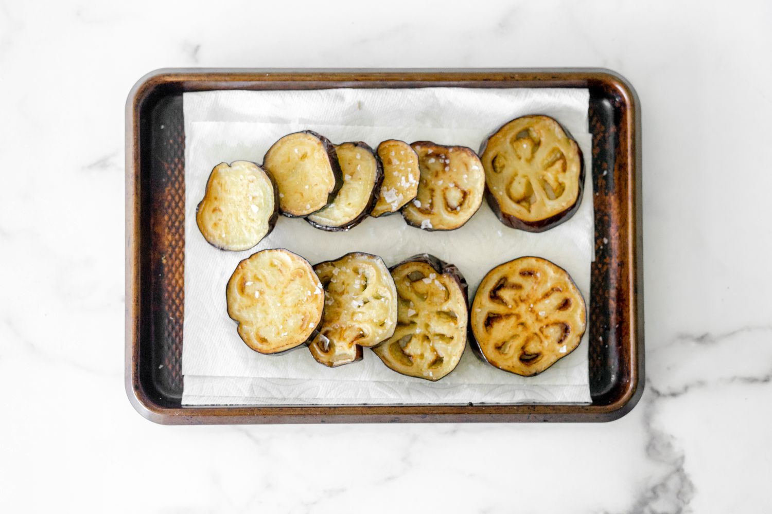 Salted Eggplants on Paper Towel Lined Tray for Sabich Recipe