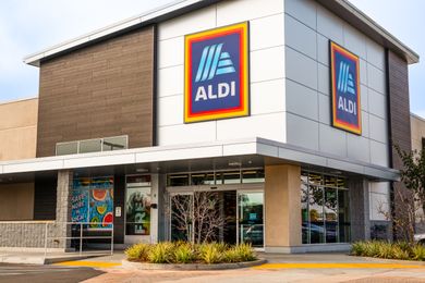 Exterior of an Aldi store with its logo prominently displayed on the building