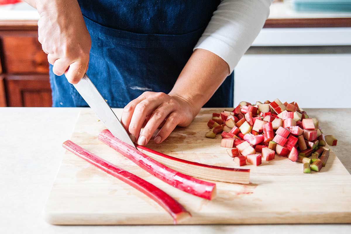 Rhubarb Custard Pie with Orange Zest - slicing rhubarb stalks