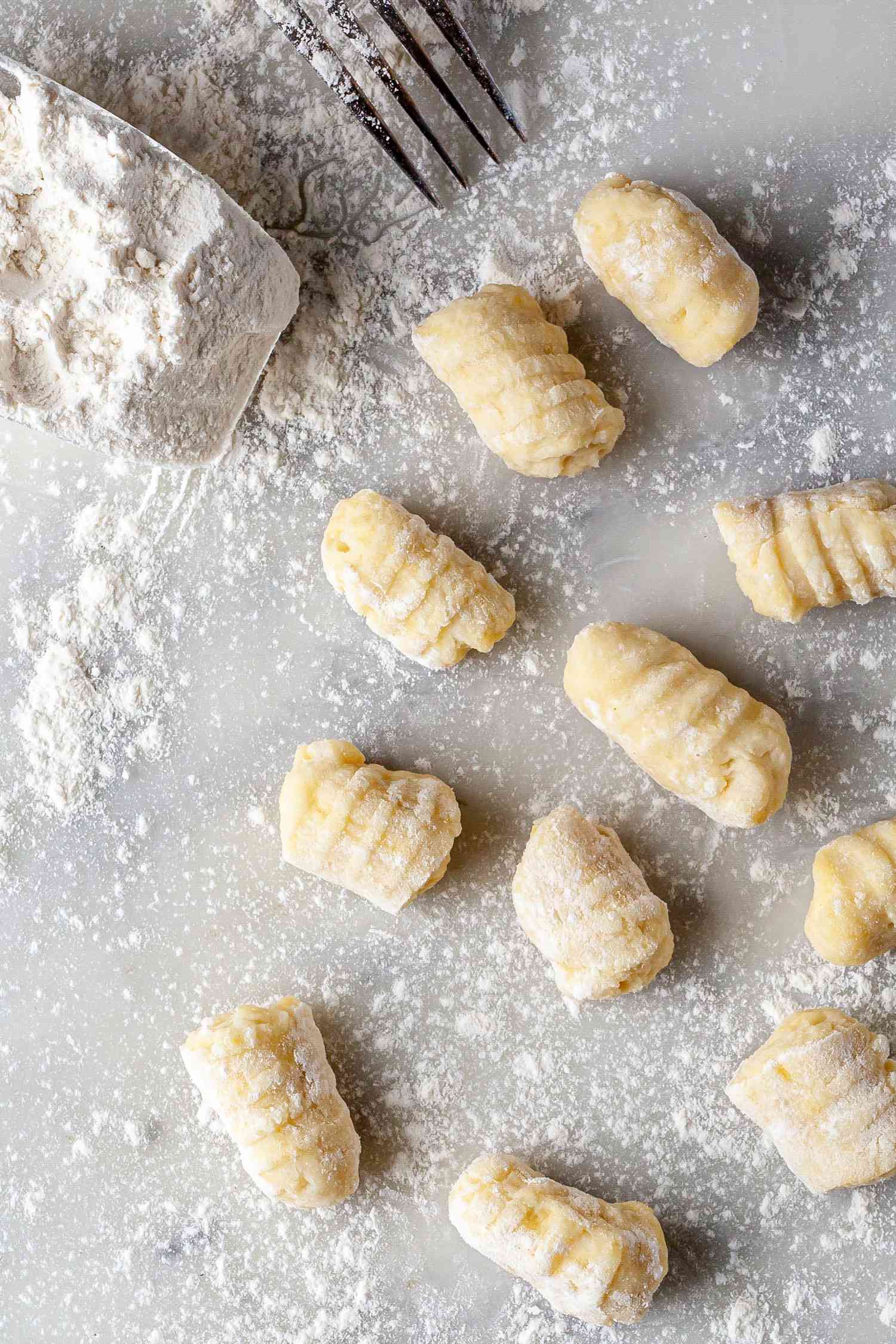 Potato Gnocchi being shaped on a floured countertop