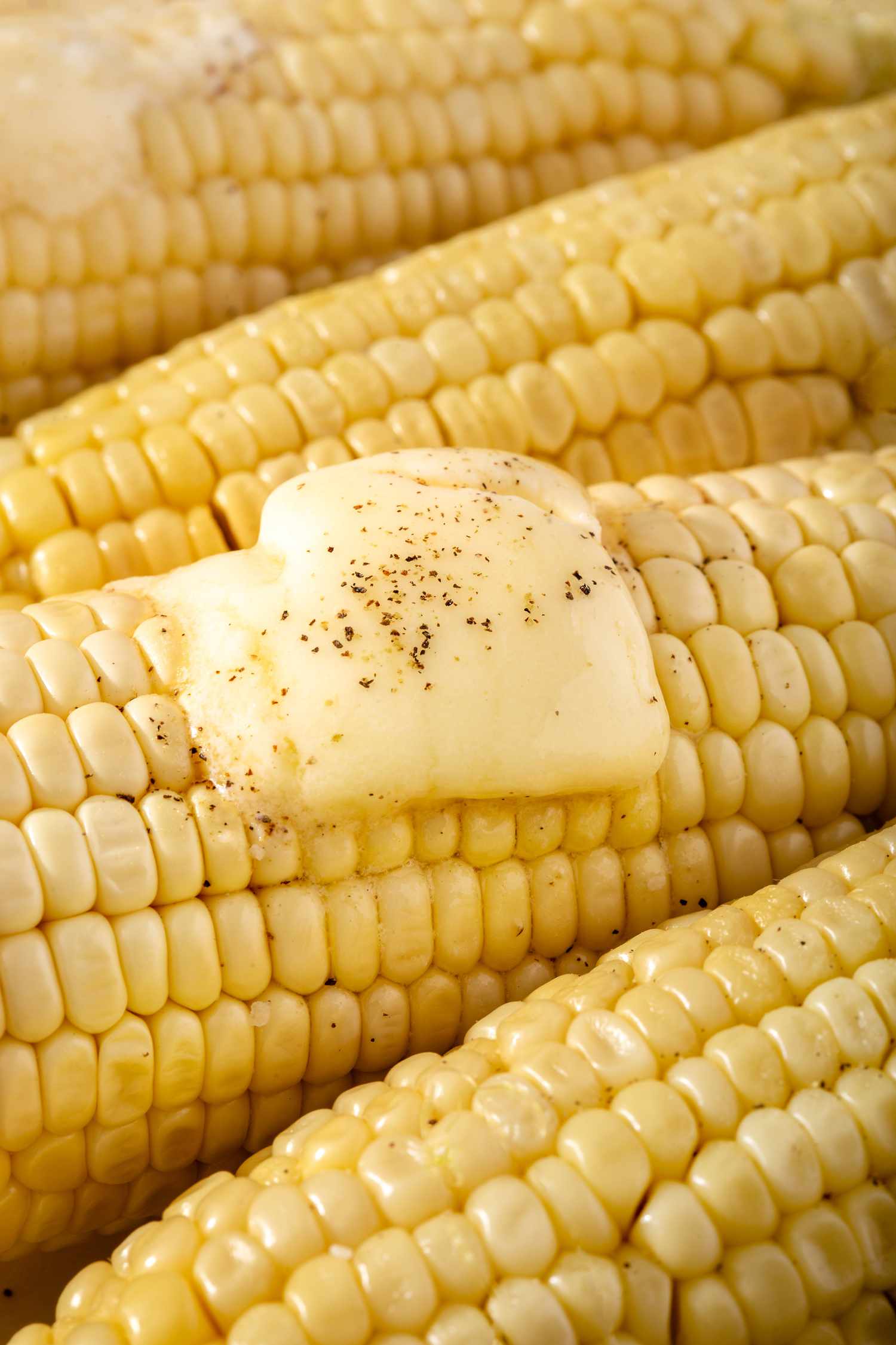 Microwave corn topped with butter.