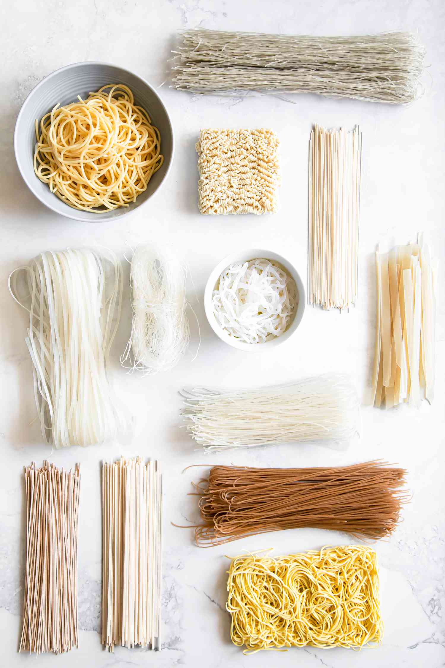 Variety of Asian Noodles on a Counter (Some Dried, Some Cooked) for A Guide to Asian Noodles