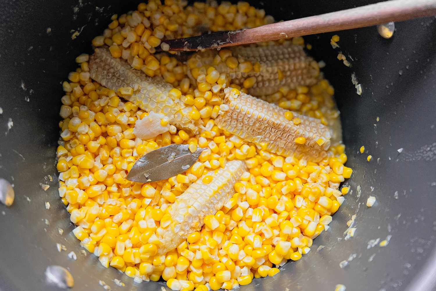 Corn Kernals, Cob, Bayleaf Cooking in a Pot for Esquites