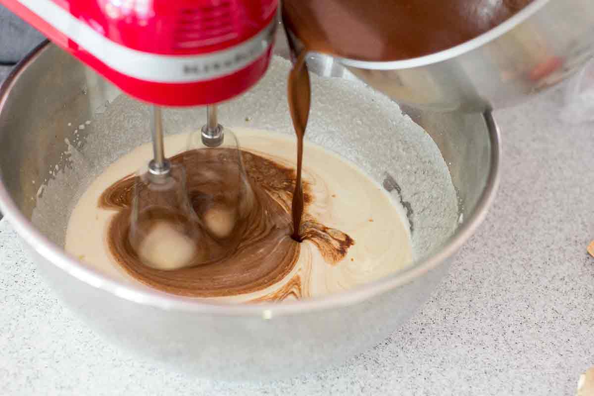 adding chocolate to cake batter