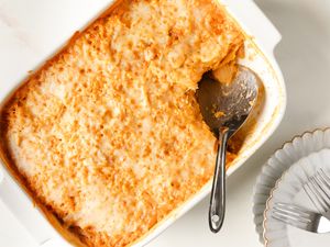 Chicken, Corn, and Tangy Cabbage Casserole in a baking dish with a serving spoon