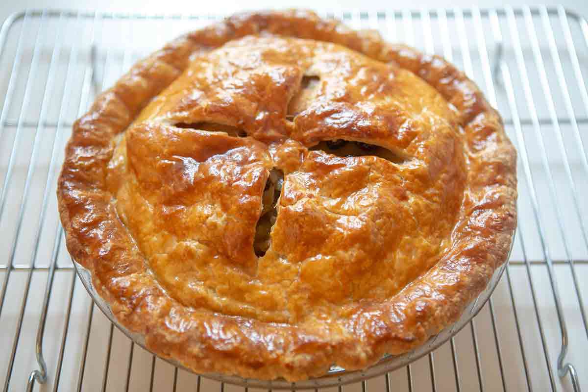 freshly baked apple cranberry pie out of the oven