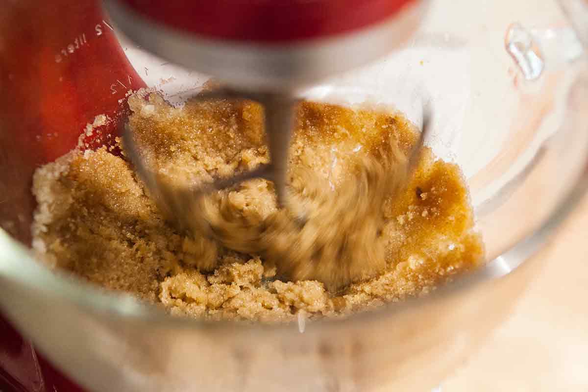 Mix the sugars and browned butter together for oatmeal chocolate chip cookie dough batter