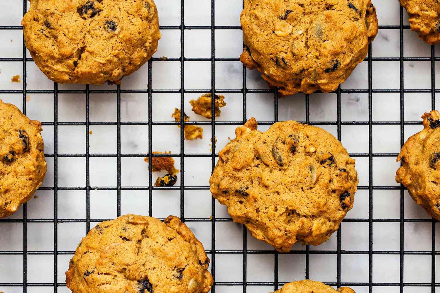 Pumpkin cookies cooling on a rack.
