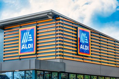 Exterior view of an Aldi grocery store with its logo prominently displayed