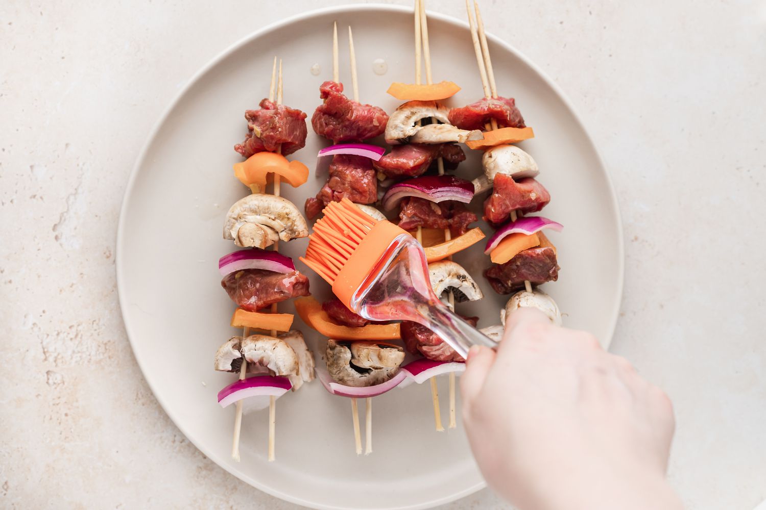 A plate of beef kabobs.