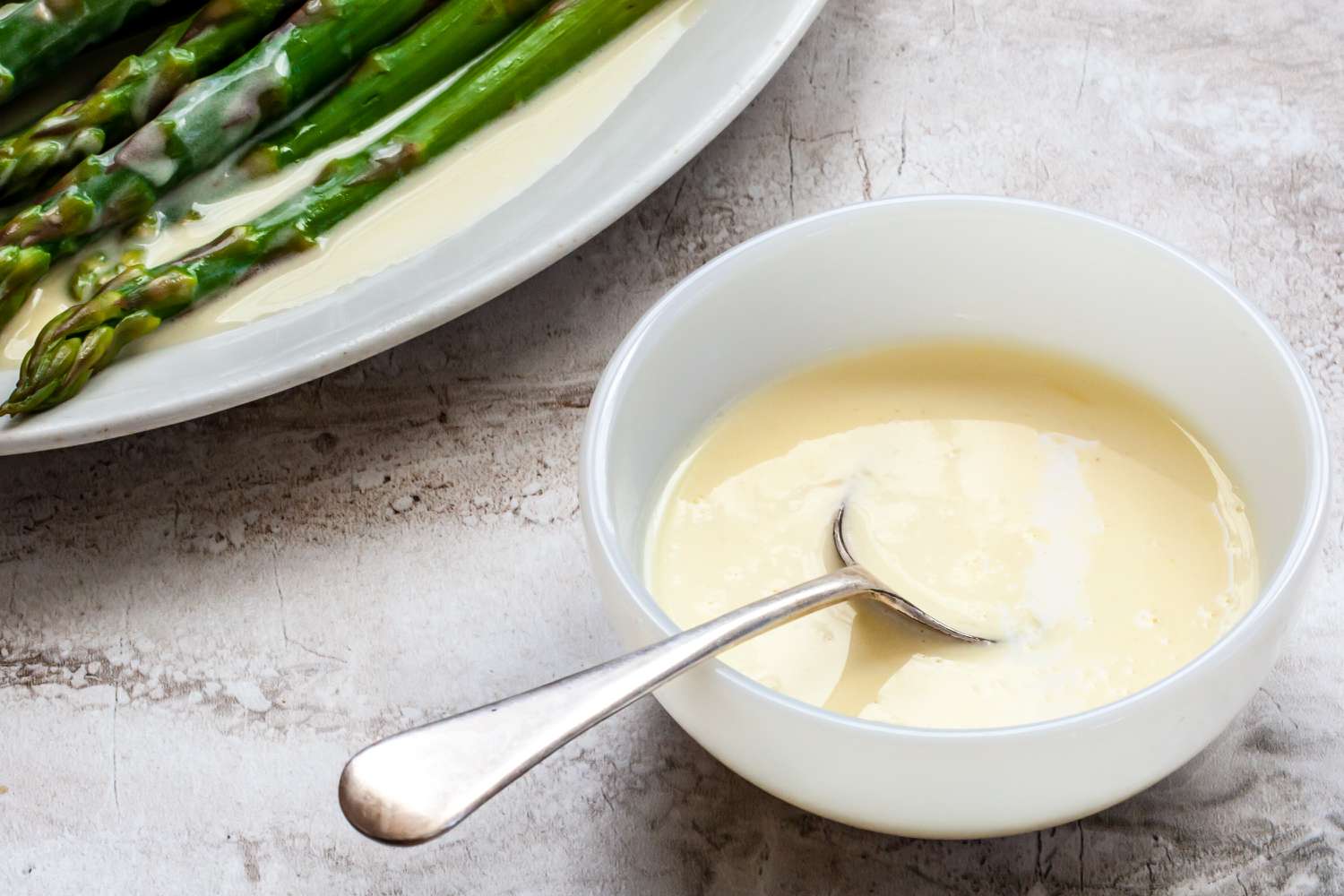 Classic beurre blanc sauce served with asparagus