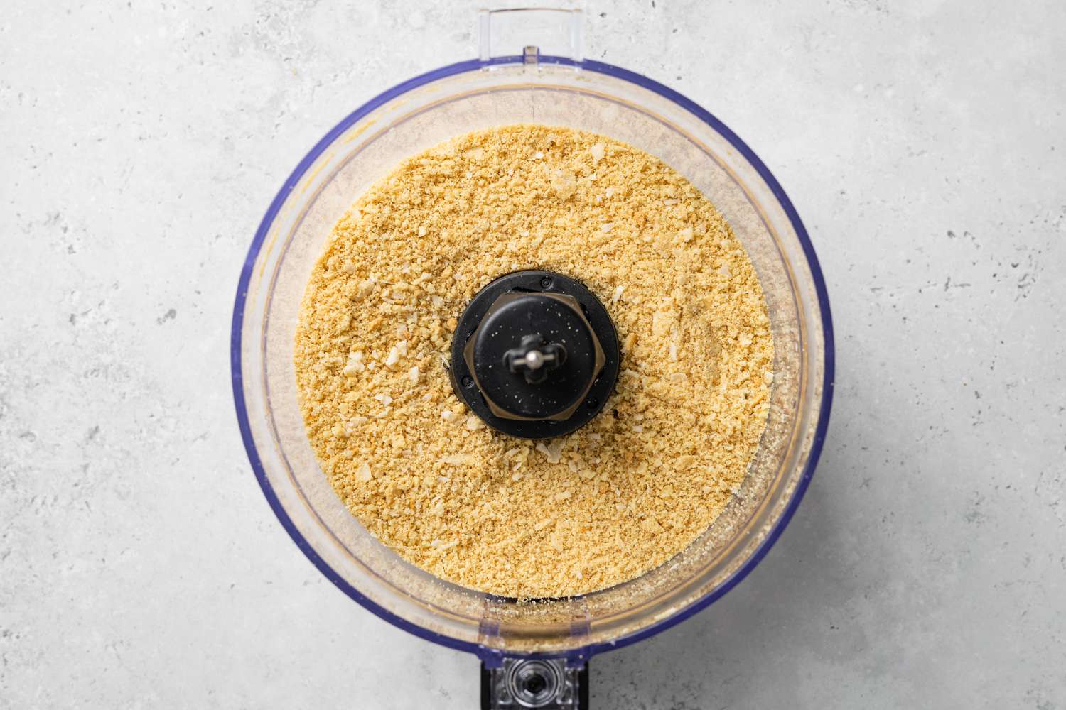 Wafers and Coconut Flakes Pulverized in Food Processor for Pina Colada Pie Crust