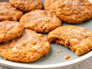 Plate of oatmeal molasses cookies one with a bite taken out