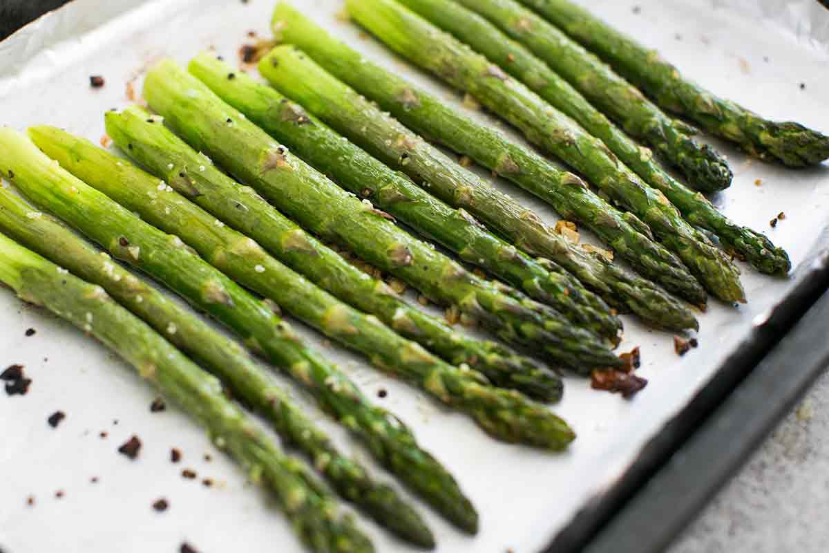 Roasted Asparagus taken out of the oven and resting on a baking sheet