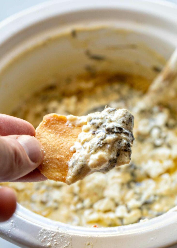 mediterranean spinach feta dip on a pita chip