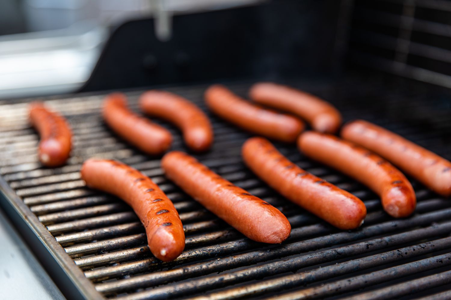 Chicago-style hot dogs on the grill.