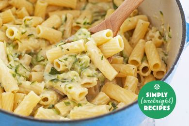 A pot of cooked pasta with creamy sauce and garnished with herbs from Simply Recipes