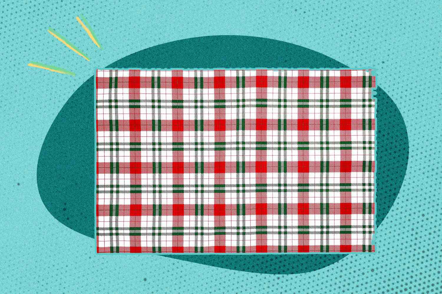 A rectangular red white and green plaid cloth against a patterned blue background