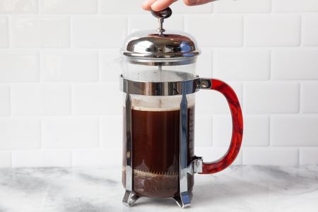 French Press Covered with Lid and Plunger Pushed Down for French Press Coffee Recipe 