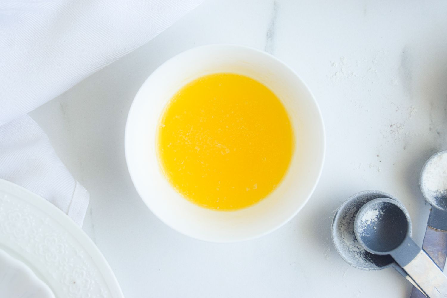 A small bowl of melted butter to make a Brownie in a Mug.