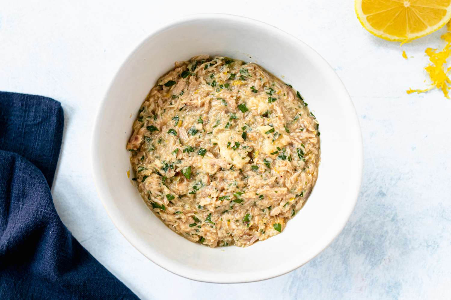 Ingredients mixed in a bowl to make a tuna patties recipe.