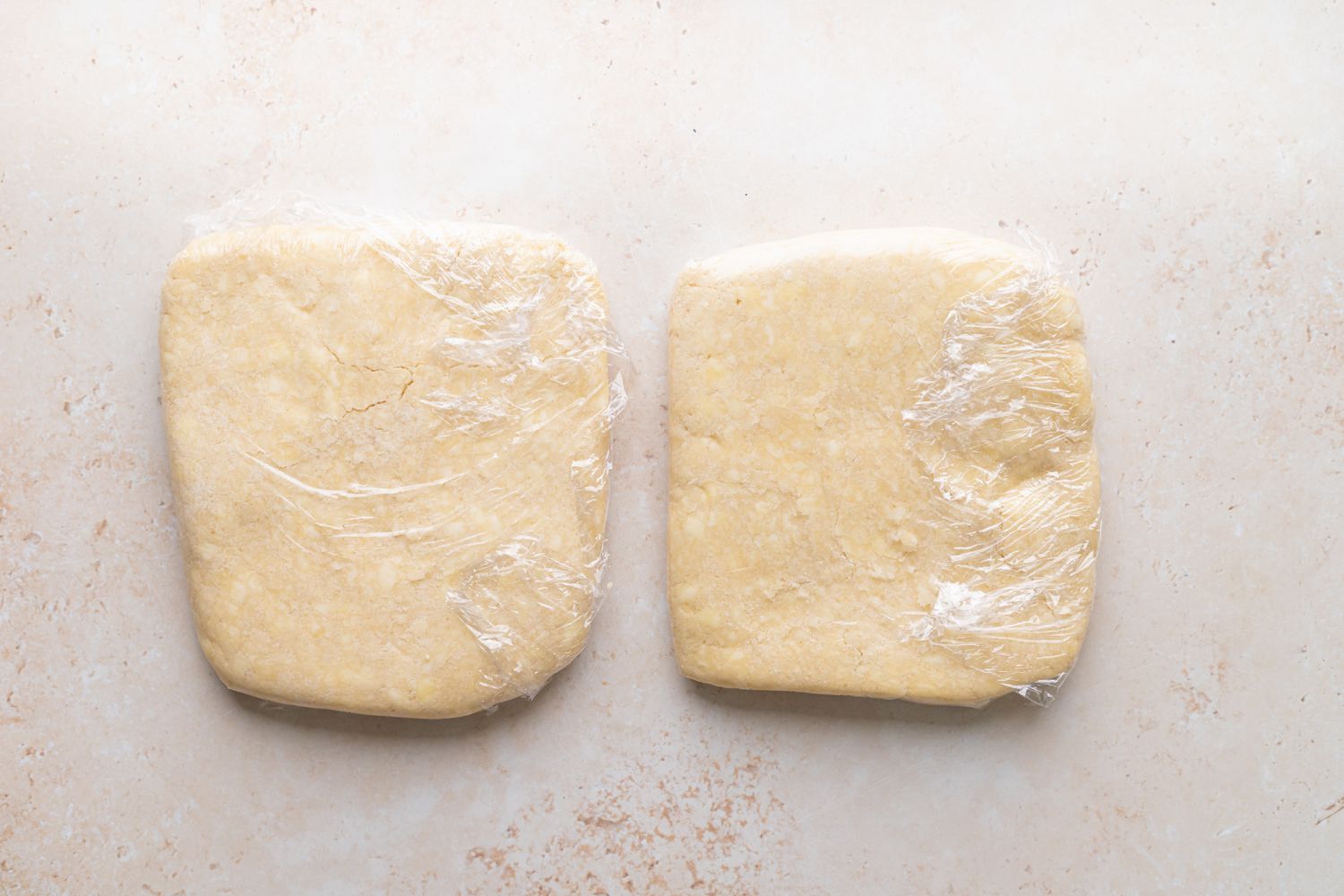 Two wrapped pie crusts to make summer peach and raspberry pie.