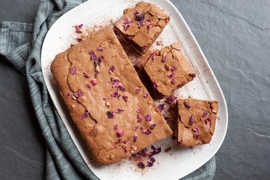 Spiced brownies on a white platter.