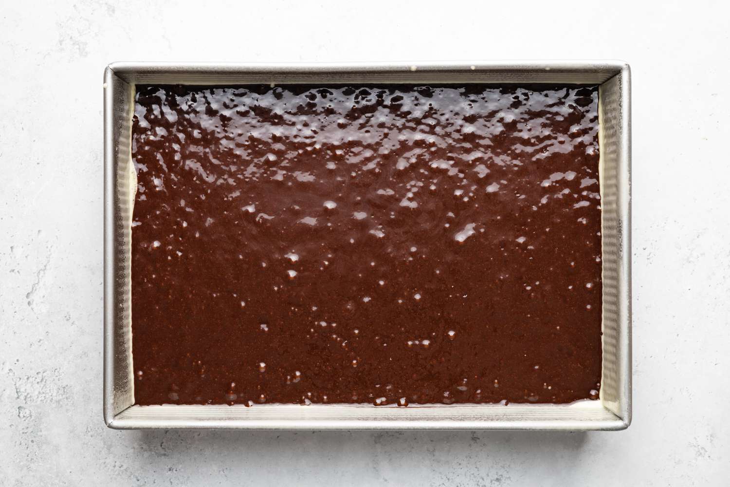 Chocolate Tres Leches Cake Batter in a Cake Pan