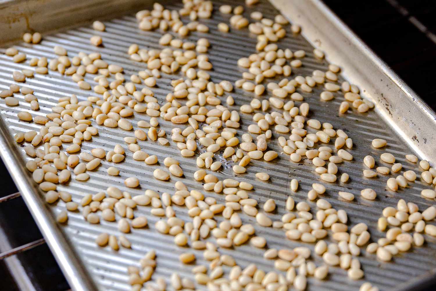 Raw Pine Nuts on a Baking Sheet 