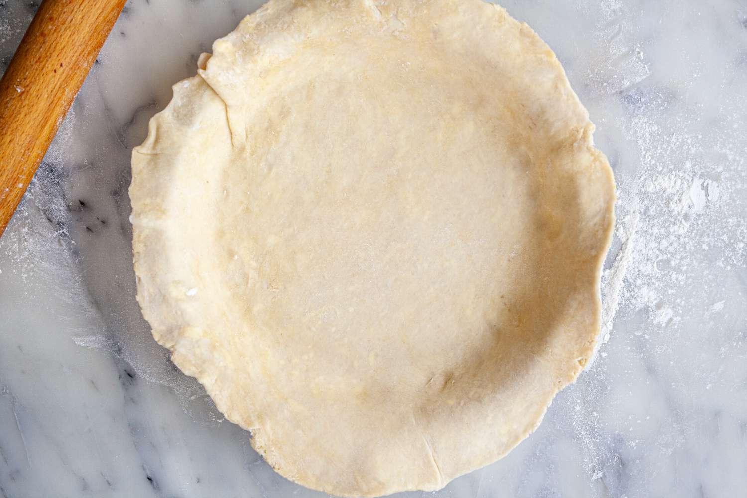 The bottom crust set in the pie pan.