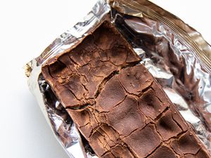 A chocolate bar showing white bloom and crackling