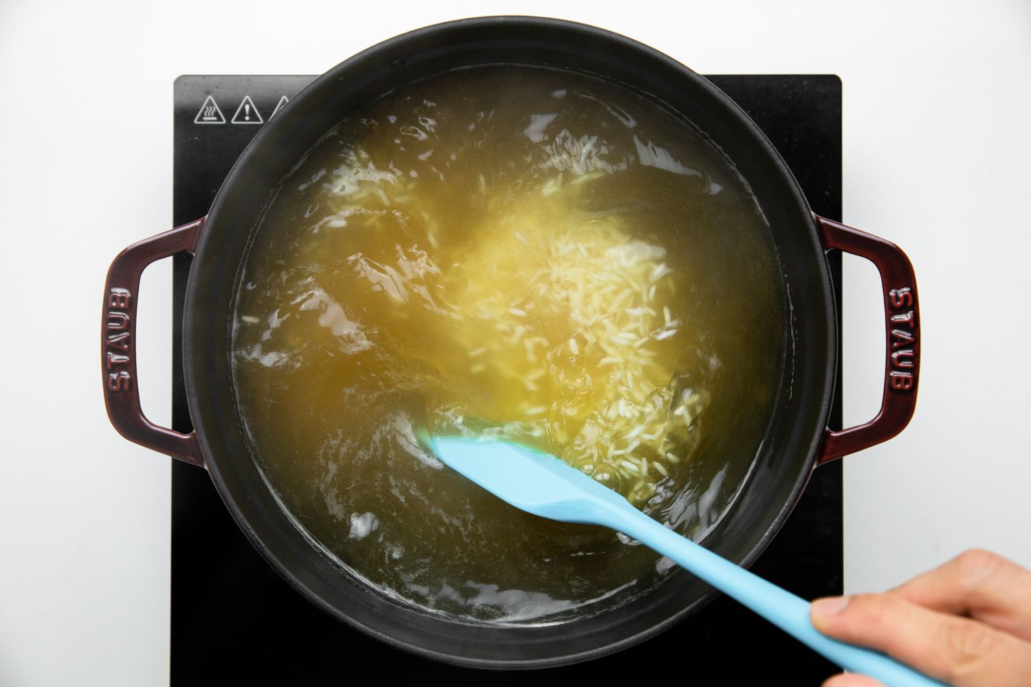 Rice Stirred into the Chicken Stock for Chicken Jook Recipe