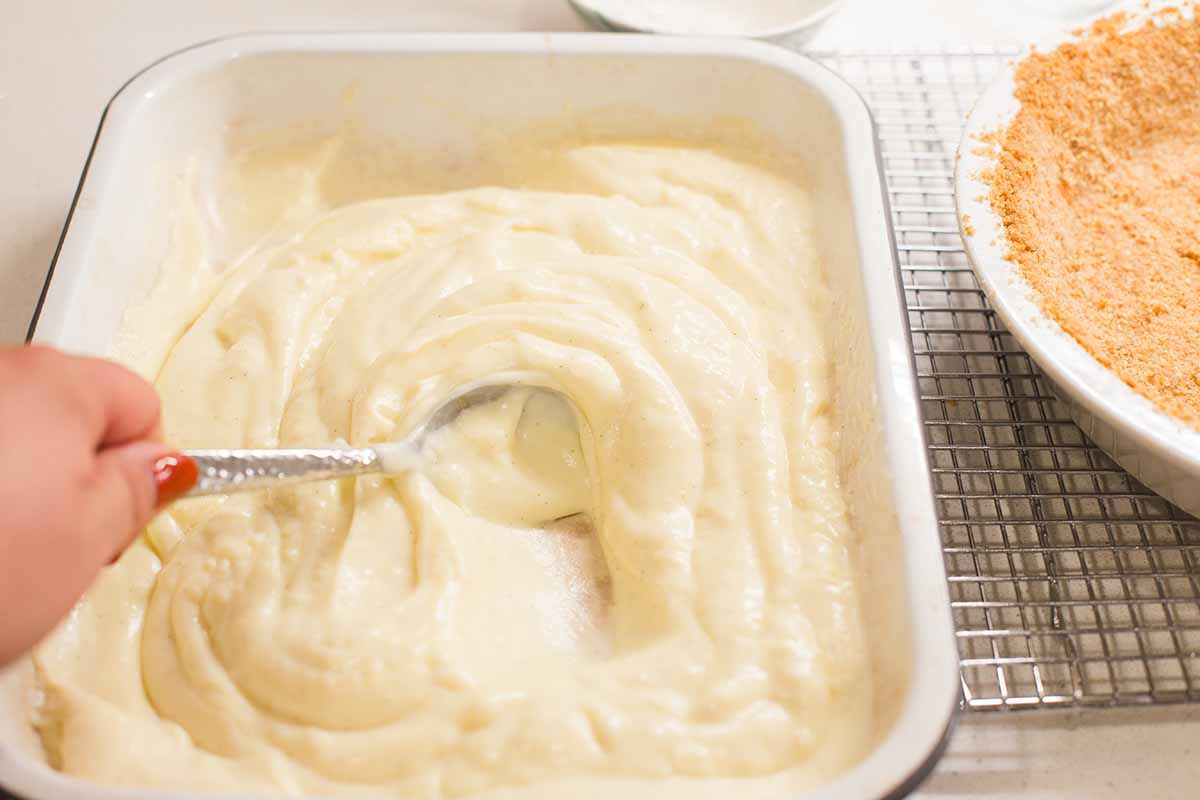 VVanilla pudding cooling in a 9x13 baking dish to make an easy homemade banana cream pie.