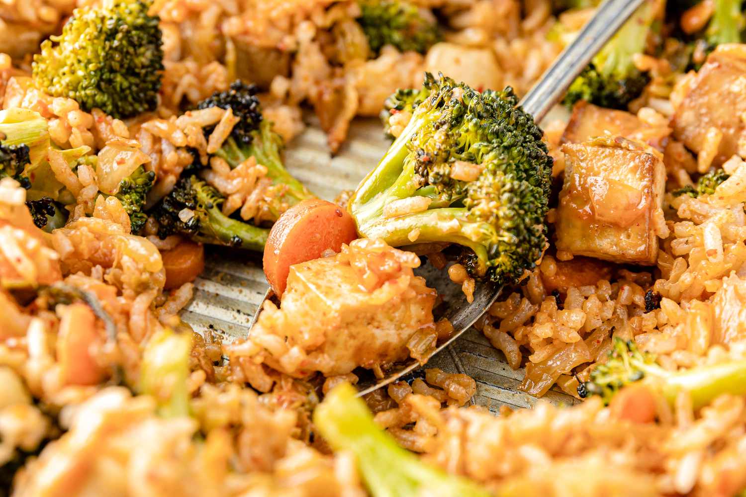 Sheet Pan Fried Rice on Sheet Pan with a Some on a Spoon