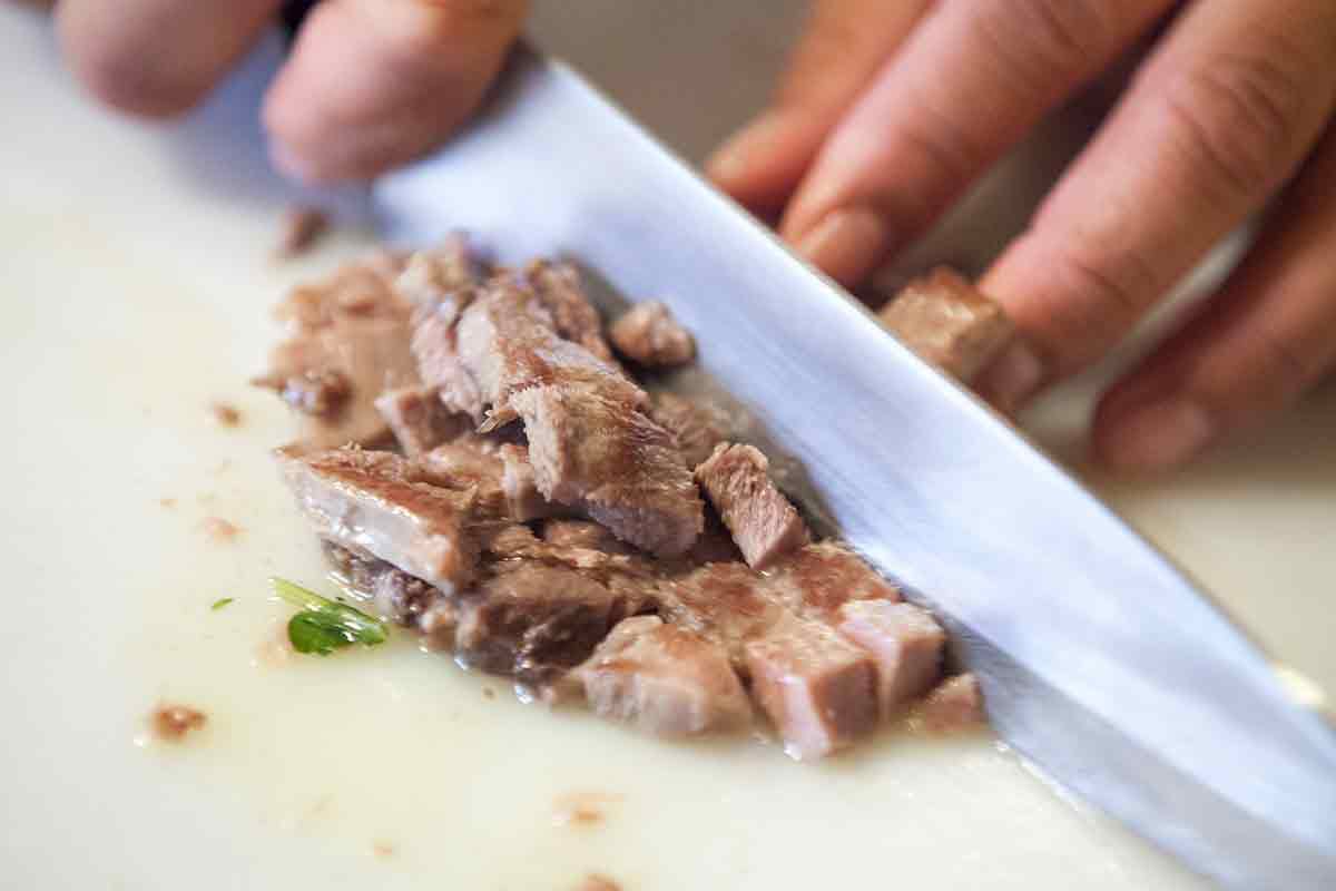 chop sliced beef tongue for tacos de lengua