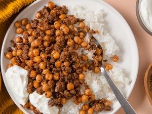 close-up of a plate of 20-Minute One-Pan Beef and Chickpeas with rice and greek yogurt
