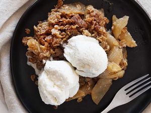 Apple crisp recipe topped with vanilla ice cream.