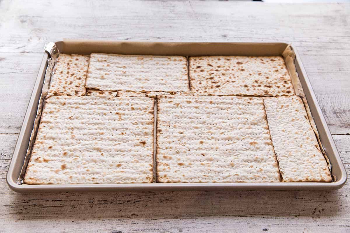 Chocolate Toffee Matzo Crack - baking sheet with matzo crackers in a single layer