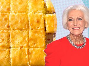 Mary Berry next to a tray of baked cut square cake pieces - - Mary Berry’s Lemon Drizzle Traybake Cake