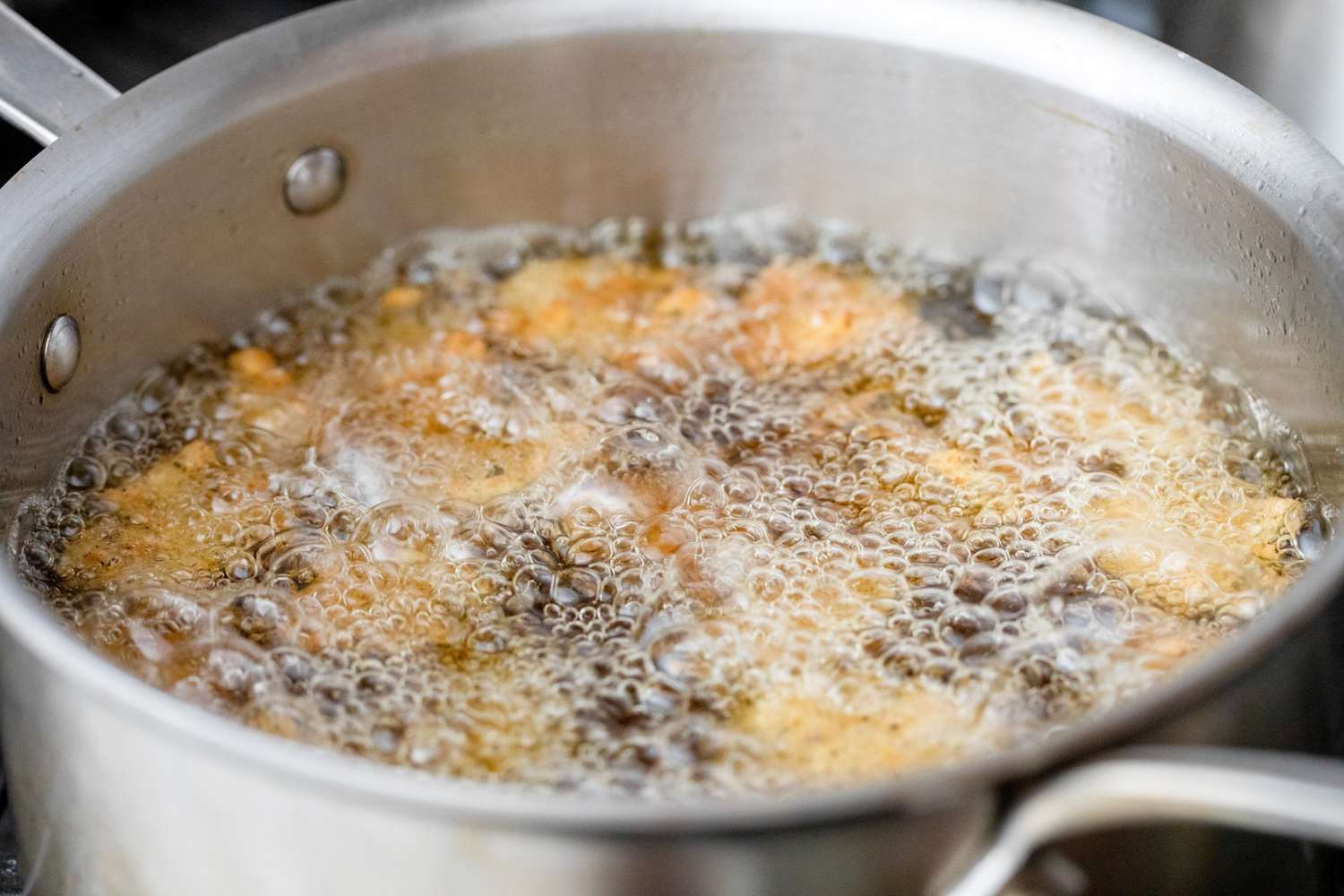 Fried Pickles Frying in a Pot of Hot Oil
