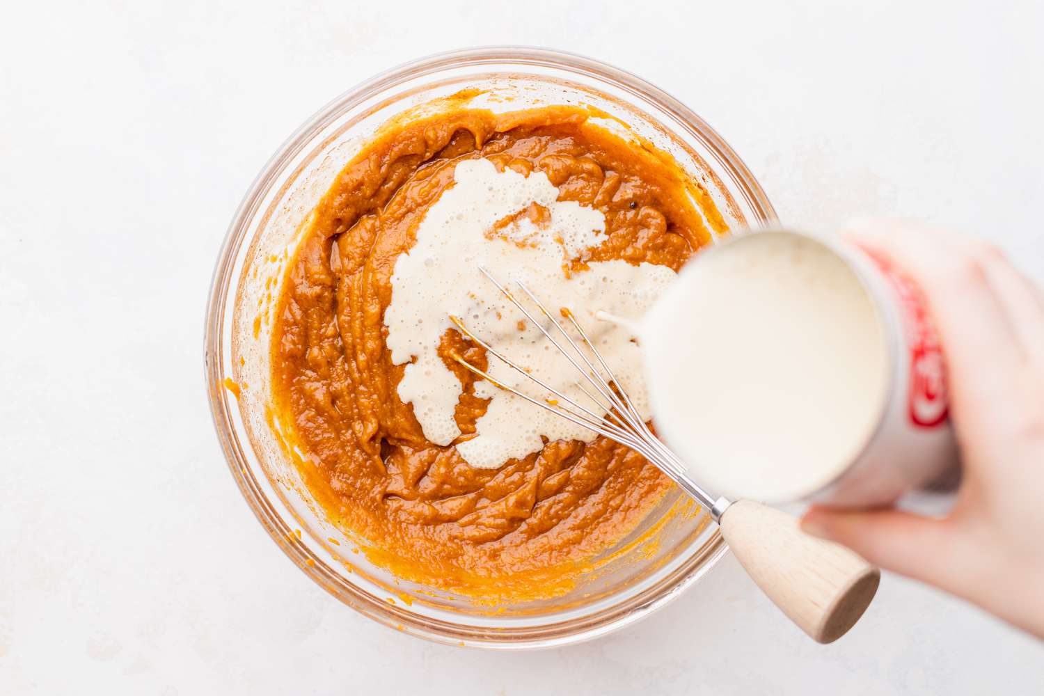 Cream Added to Bowl with Other Ingredients for Pumpkin Pie