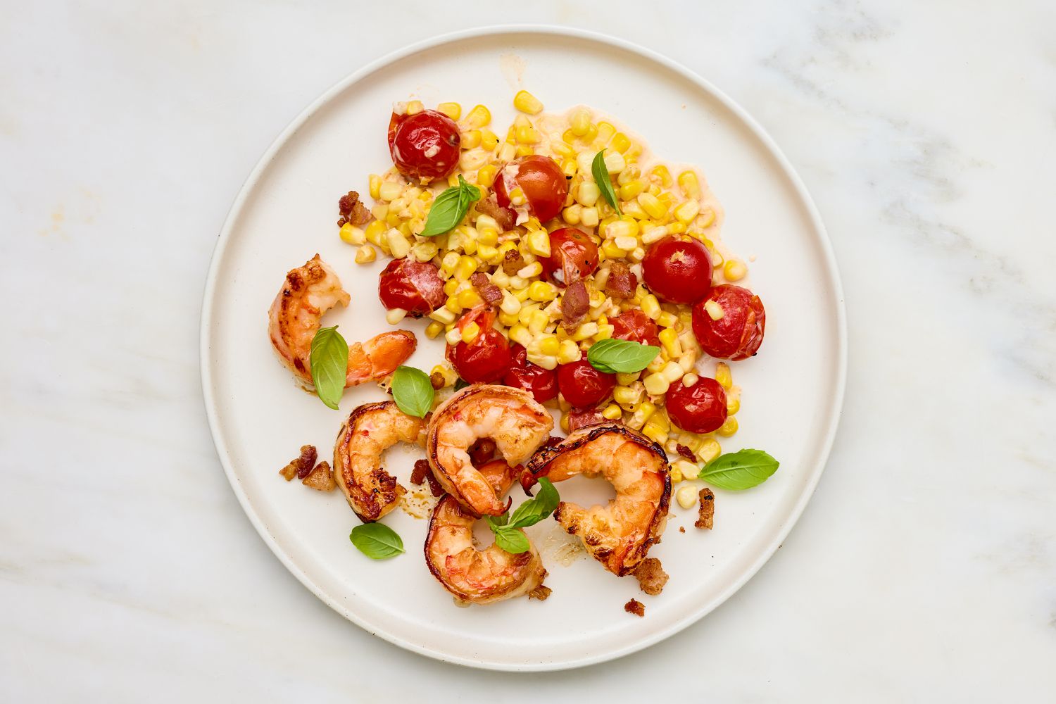 Creamy Skillet Shrimp with Corn, Pancetta, and Tomatoes on a plate