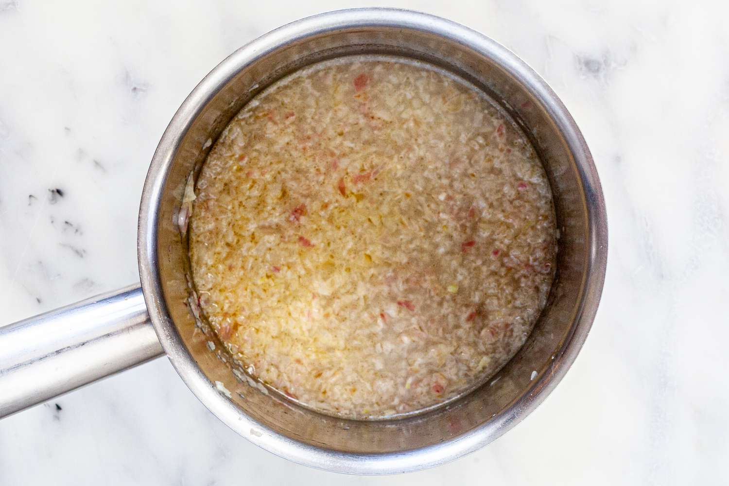Melted butter, shallots, and white wine for classic buerre blanc sauce