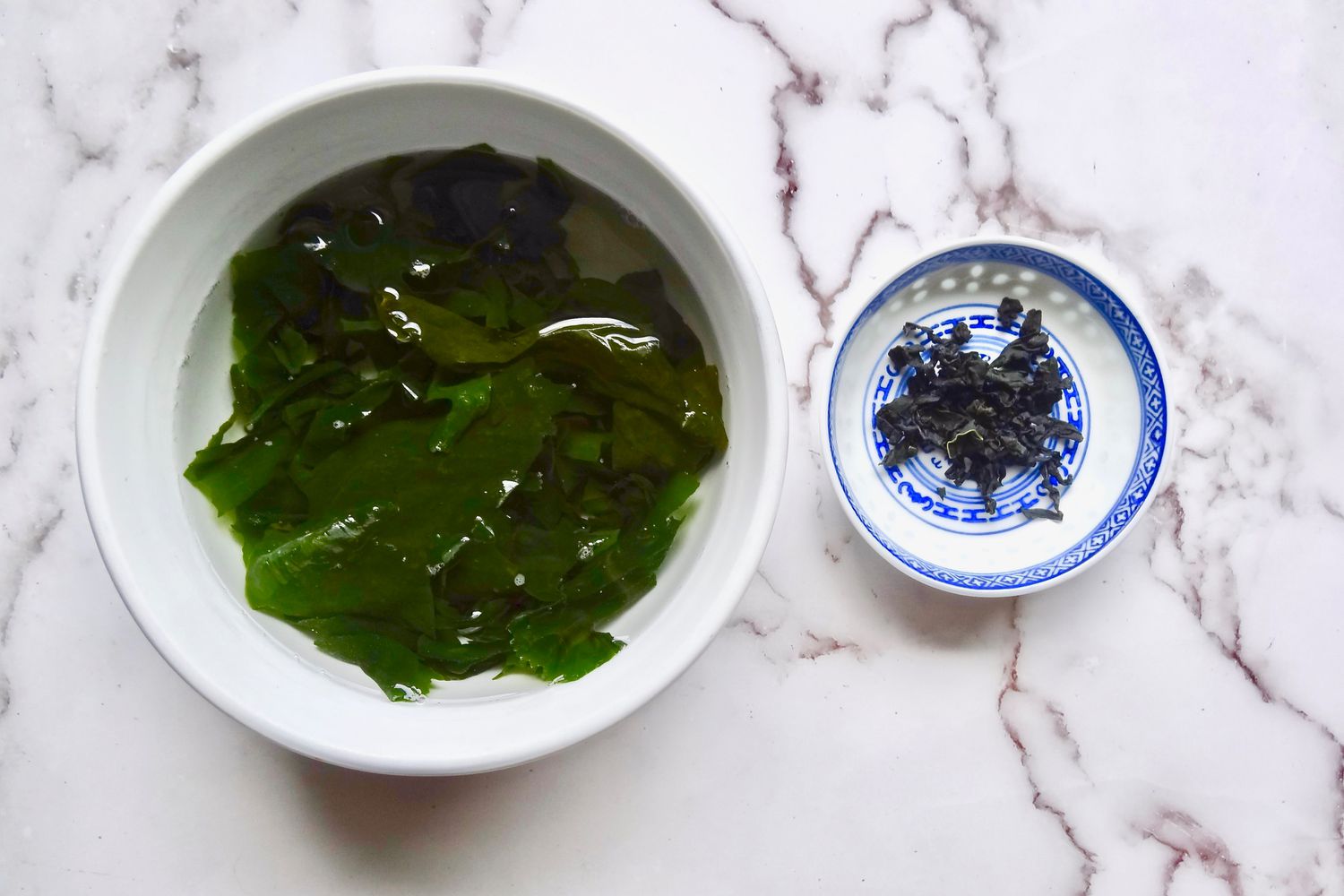 Rehydrating wakame in a bowl to make homemade miso soup.