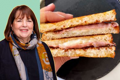 Ina Garten in the foreground, a hand holding a sandwich in the background